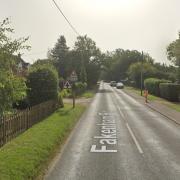 A woman is in hospital after a two-car crash near Dereham