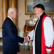 King Charles III holds an audience with Rt Rev Graham Usher, Bishop of Norwich, at Buckingham Palace, London, as he is appointed to be Lord High Almoner