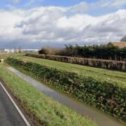 A school bus carrying children overturned into a ditch