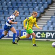 Tamsin Medd-Gill brings the ball out from the Canaries defence