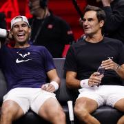 Roger Federer, right, shares a joke with Rafael Nadal (John Walton/PA)