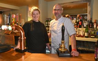 Emily Phipps and Richard Crouch behind the  bar at The Angel at Watlington Picture: Sonya Duncan