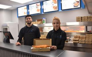 Siblings Ercan and Tuvana behind the counter at Ocean Bites Fish and Chips